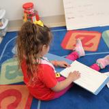 Blind Children's Center Photo - Learning to read a braille book