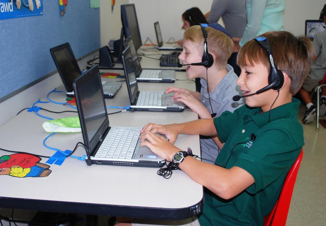 Jewish Community Day School Photo - Third, Fourth, and Fifth Grade Students work with laptops throughout the day and communicate with students from Israel during their Hebrew Language class.