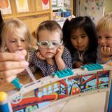 Park Street School Photo - Toddler friends learn about habitats with an ant farm. Exploring and learning are are a fun part of our day. This foundation in science will be built upon over multiple years creating important background knowledge necessary for future learning.