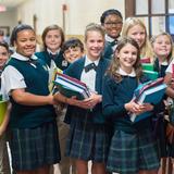 The Oaks Academy Photo - Middle School students pause for a photo in the hallway during passing period.